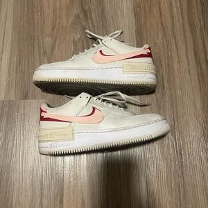 Pink and red Nike air forces